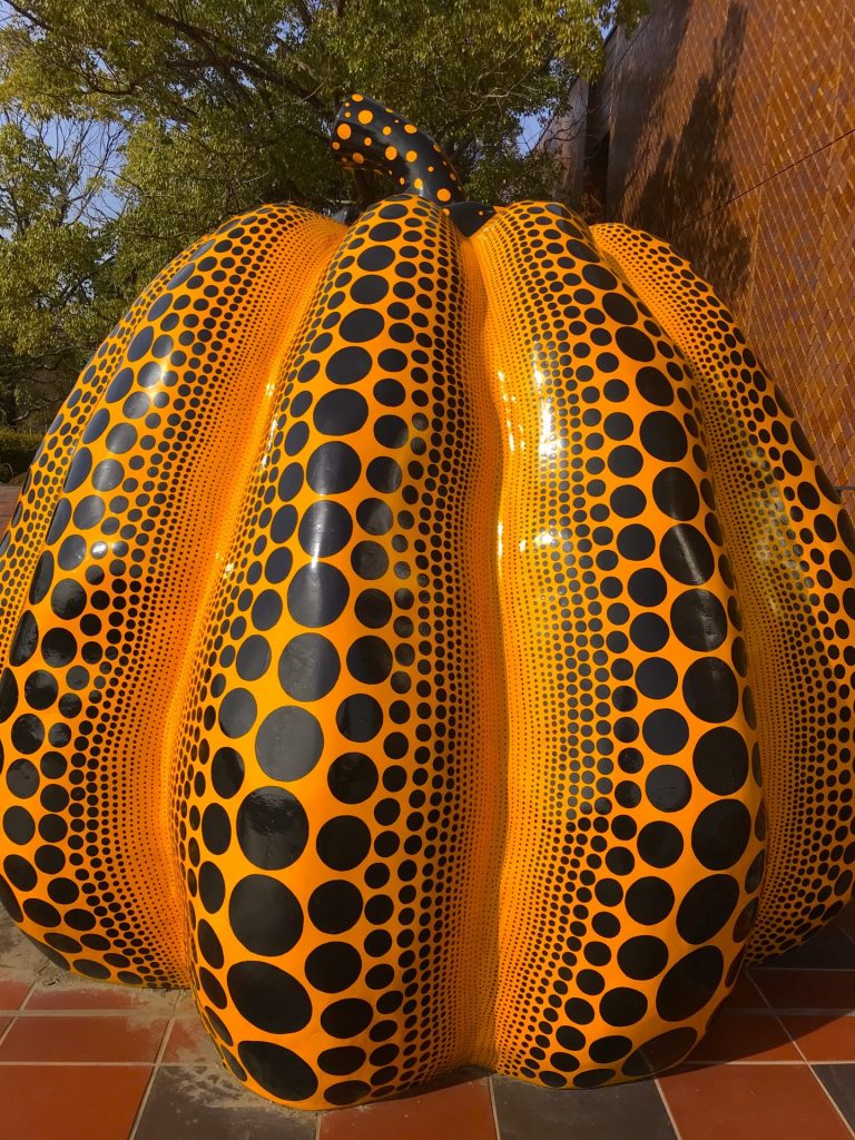 This artwork is by the famous Japanese artist, Yayoi Kusama. This one's a giant pumpkin with distinctive dots on it, the artist's signature. You'll chance upon this outside the Fukuoka Art Museum.